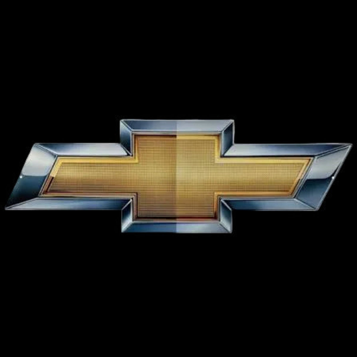 A Chevrolet bowtie emblem with a textured gold center and a polished silver-blue metallic border, shown on a plain black background.
