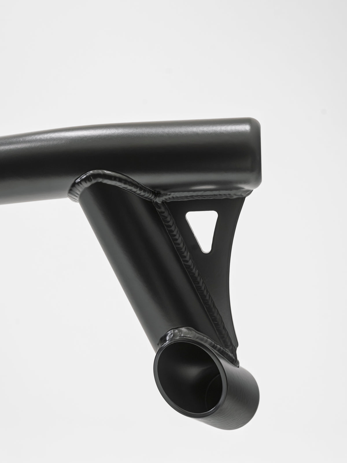 Close-up of weld detail on a Lewis Built Performance APEX light mount, shown on a white background.