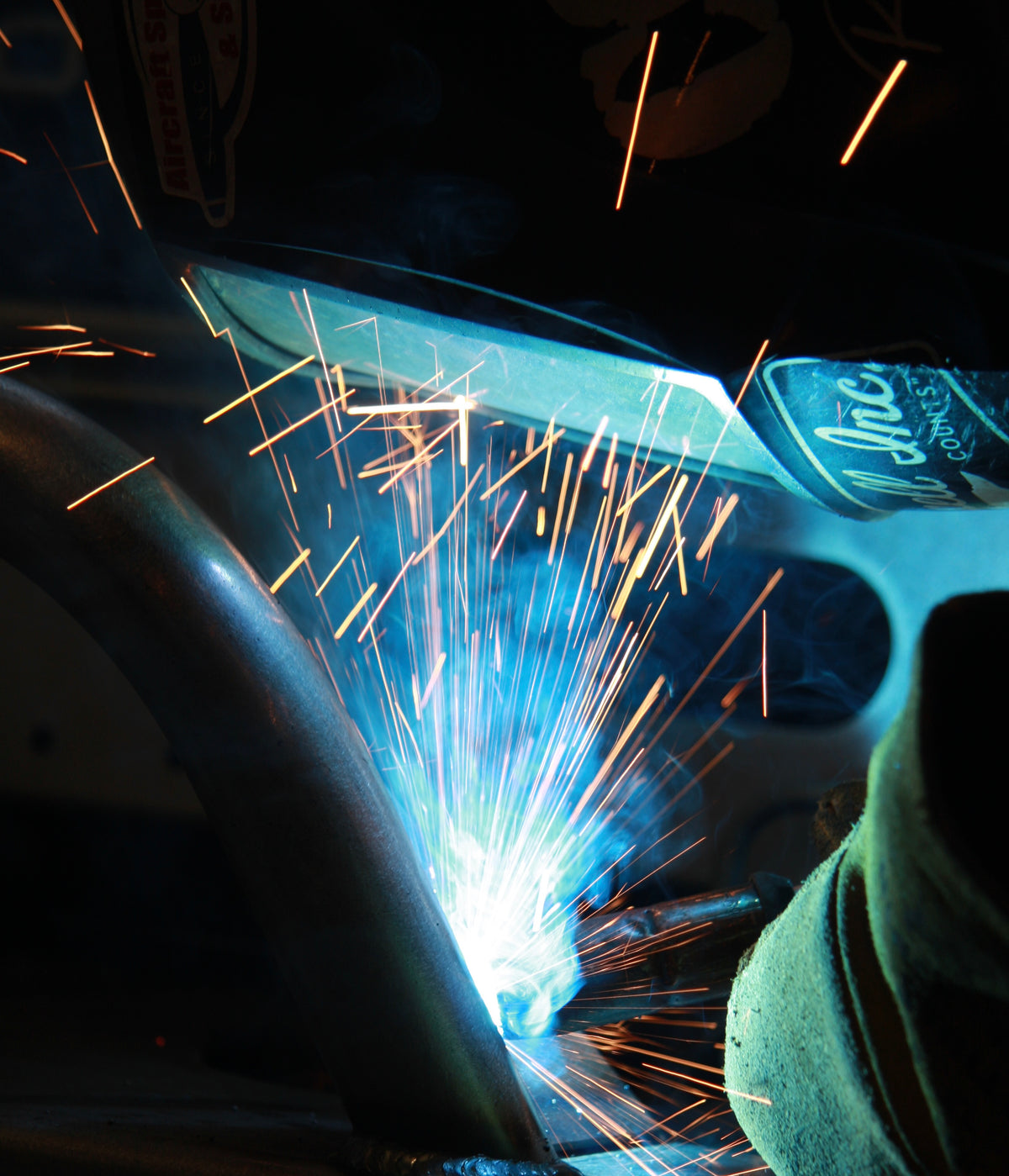 Mig welding truck bumper with sparks flying